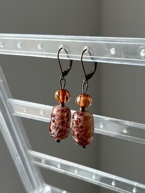 tortoiseshell glass dangly earrings with silver chrome design and amber beads